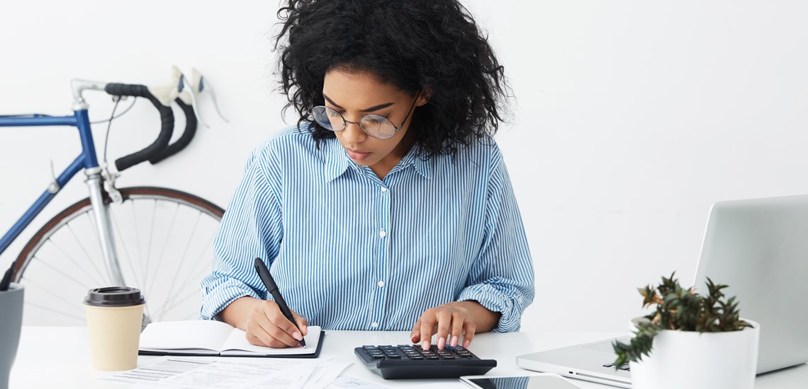 woman-writing-calculations-notepad-financial-advice