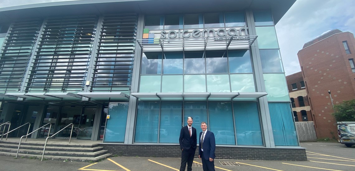 head-of-wealth-dave-magee-and-ben-woodbridge-stocks-infont-of-spicerhaart-head-office