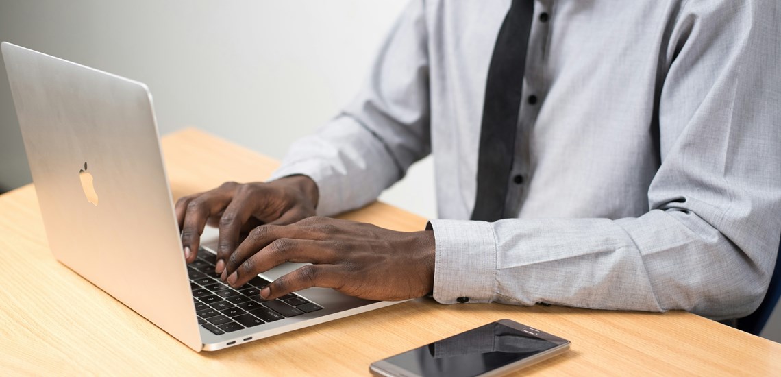 male-adviser-working-on-laptop-referrals